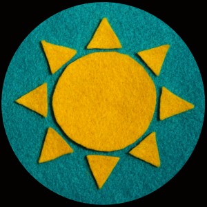 A felt image of a sunshine symbol